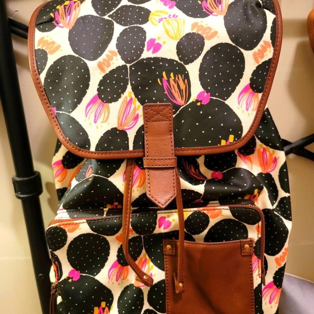 Fossil backpack.  Black with pink flowers brown leather trim